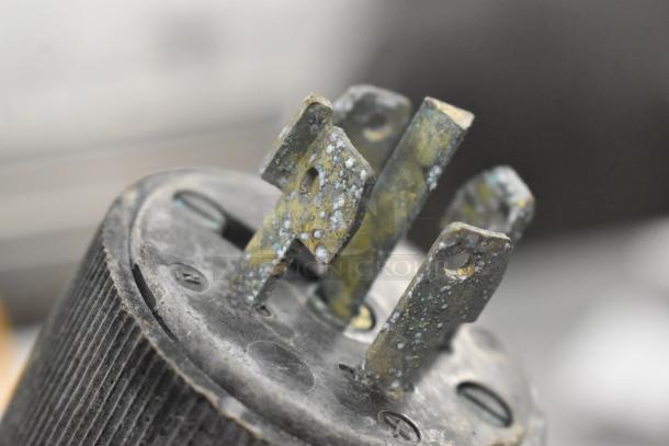 Close-up of a corroded plug from a Pokomat P16/320 SI brine meat injection machine.