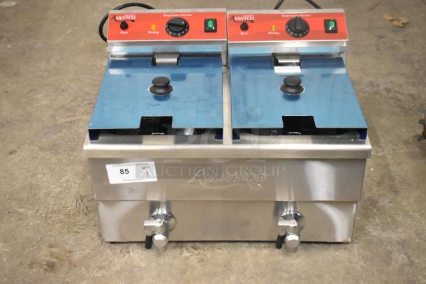 Brand new Avantco 177F202 30 lb. dual tank electric fryer with two metal lids and fry baskets, 208-240V, seen with labels.
