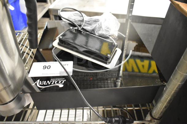 Brand new Avantco 177DC1800 induction range with remote control, minor scratches. 120 Volts, 1 Phase, countertop model.