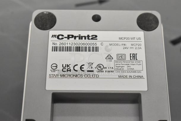 Brand new C-Print MCP20 WT US receipt printer, model MCP20, 24V 2.0A. Labels show certifications and manufacturing details.