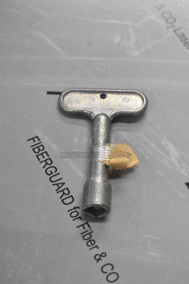 Key for Zurn Elkay Z1321-CXL-8 wall hydrant, metal construction, new condition with minor scratches, Fiberguard packaging.