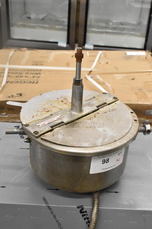 Stainless steel popcorn kettle for popcorn machine, used condition, visible wear on lid, attached piping, auction label "98" shown.