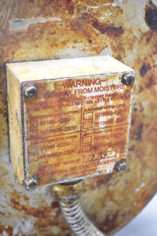Rusted popcorn kettle with visible warning label; suitable for 120V setup. Ideal for popcorn machines. Condition shows significant wear.