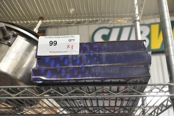Three light-up signs in original boxes, labeled "Open/Closed," on a metal shelf. Auction tag reads "QTY x3," lot number 99.