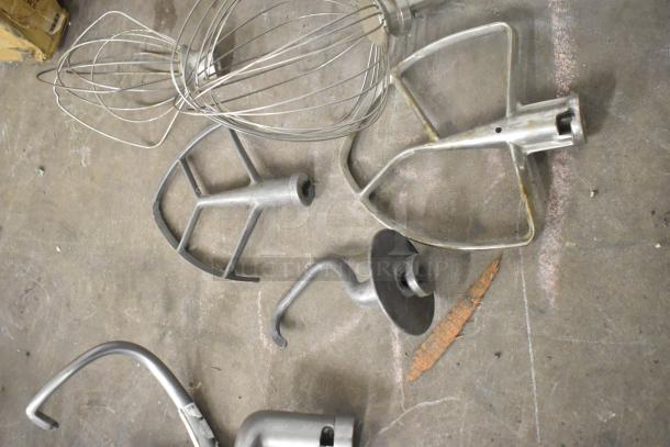 11 mixer attachments including pastry, 4 paddle, 3 dough hook, 3 whisk; metal, used condition, various styles.
