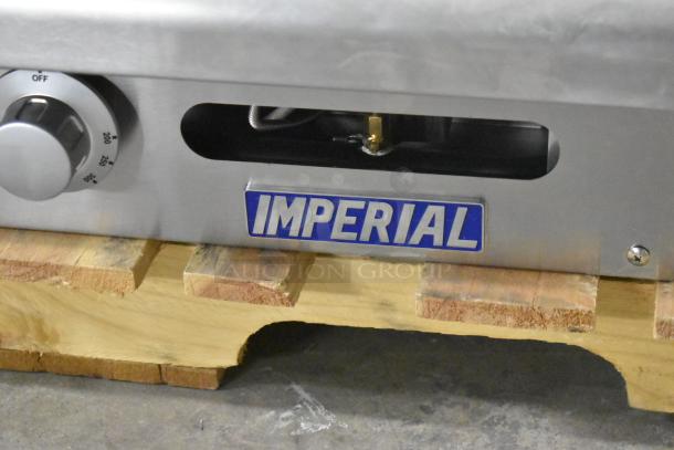 Brand new Imperial Range ITG-36LP 36" thermostatic propane griddle, 90,000 BTU, countertop model, some scratches and dents visible.