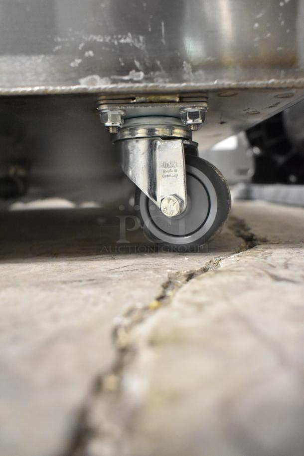 Brand new oil grease trap with Frymaster 2025 flue assembly, Gf14. Features Blickle caster wheel, made in Germany.