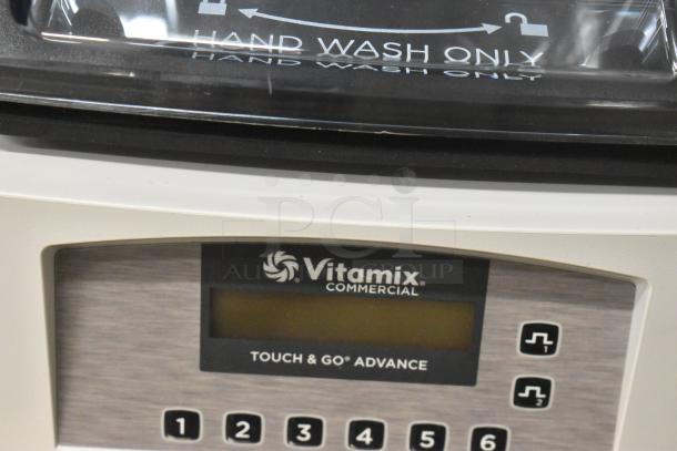 Vita-Mix VM0214 T&G Advance Blender, brand new, 2.3 hp, with cover. "Hand Wash Only" label visible. Touch & Go Advance panel.