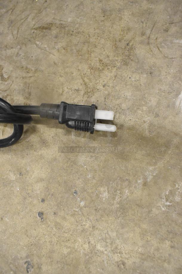 Plug and power cord for a ServIt 423SW48TLCPA lighted strip warmer, 120 volts, 1 phase, on concrete floor.