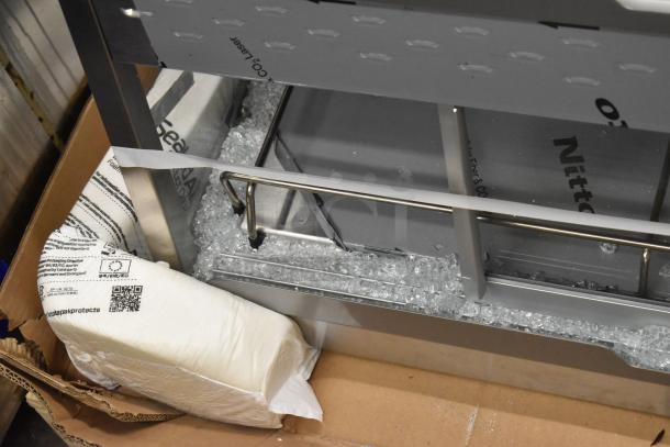 Hatco GRHD-4PD merchandiser in white granite stainless steel, showing glass damage. Powered by 120/208 volts, 1 phase.