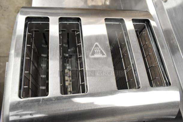 Brand new Galaxy MDT4 4-slice commercial toaster with 1 1/2" slots, stainless steel, shows scratch and dent. Model 184MDT4.
