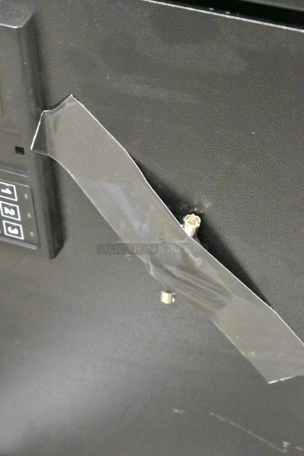 Black steel 360 Office Furniture wall-mount key cabinet safe, 700 key capacity, electronic keypad, 23"x13"x29.75". Scratch and dent condition.