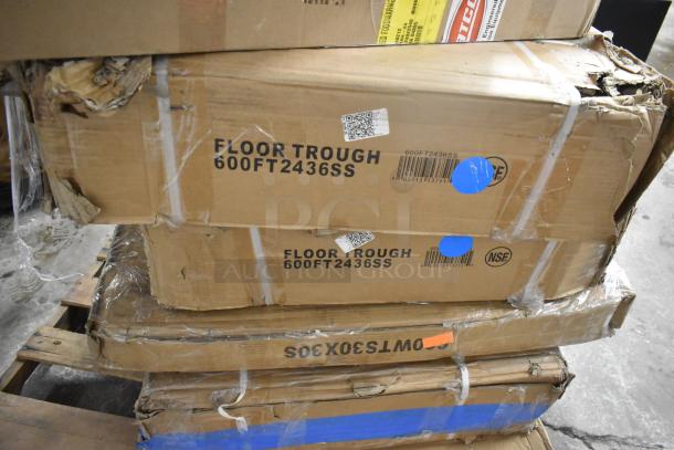 Stacked boxes labeled "Floor Trough 600FT2436SS"; visible wear and tear on packaging; items are scratch and dent.