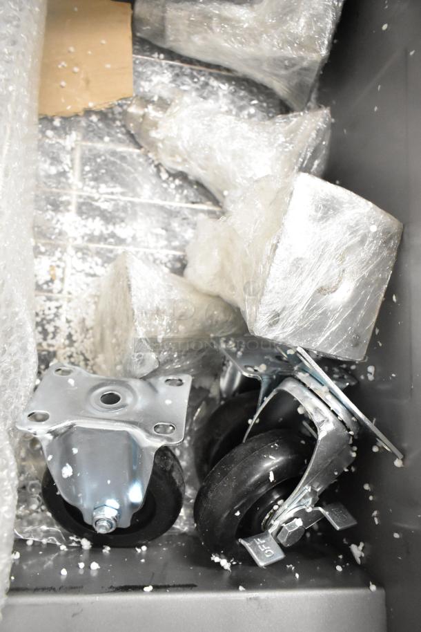 Casters for Avantco FF100 floor fryer, wrapped for protection. New condition with minor cosmetic dents, ready for assembly.