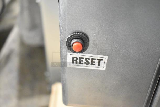 Reset button on Avantco 177MX10H commercial mixer. Label reading “RESET” nearby. Brand new scratch and dent condition.