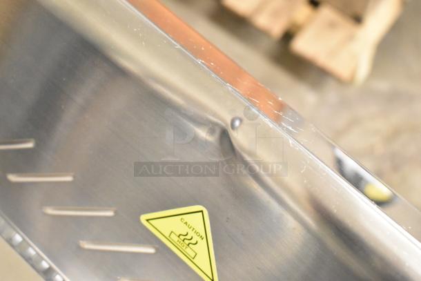 BRAND NEW SCRATCH AND DENT! ServIt 423HDM26SA 26" display case shows dents and scratches. "Caution Hot" label visible.