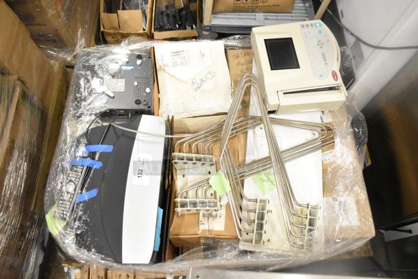 12 various items including a Marquette MAC1200 EKG machine, metal racks, and boxed items. Sold at 12 times your bid.