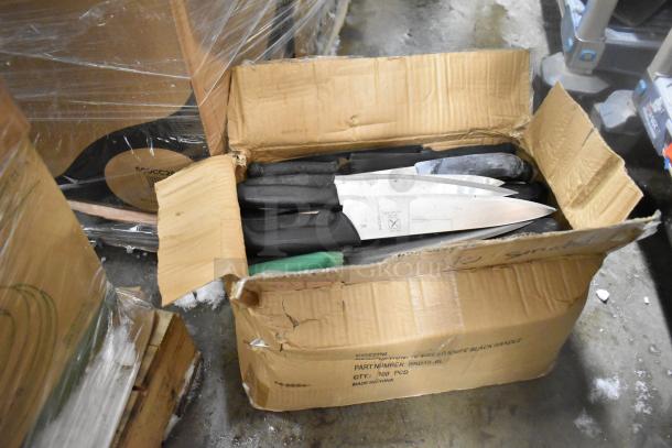 Box of 62 sharpened stainless steel knives, including chef knife, in shipping box with visible labels and markings.