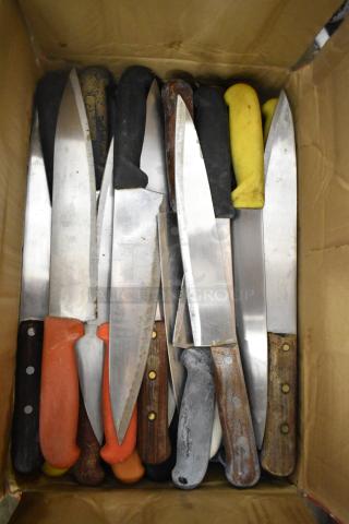Box of 85 sharpened stainless steel knives, assorted handles, including chef knives. Signs of wear visible.