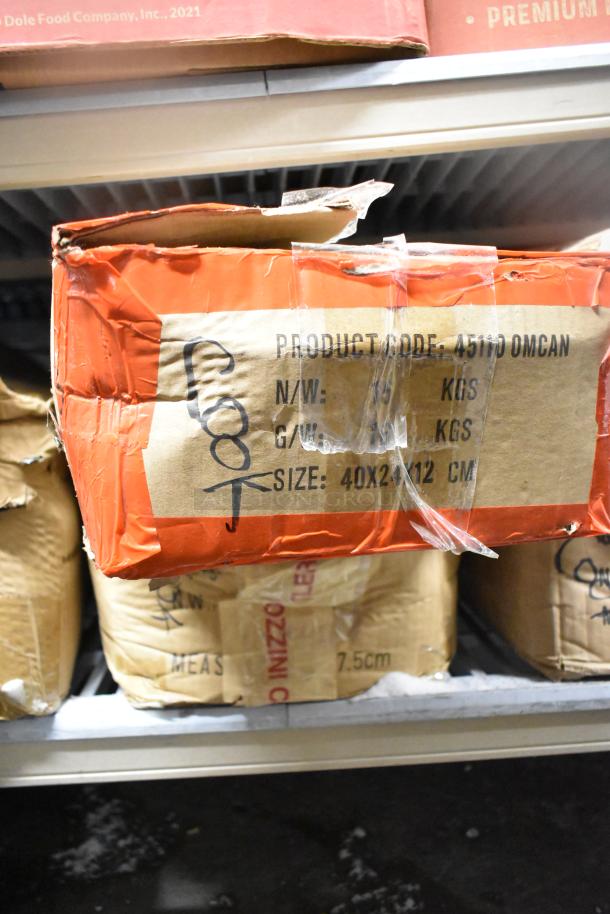 Box labeled "Product Code: 45110 OMCAN," containing 85 sharpened stainless steel knives, including a chef knife, packaging damaged.