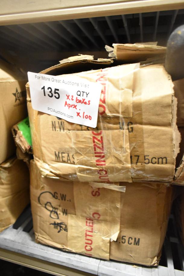 Auction item: Two boxes of 100 sharpened stainless steel knives, including chef and serrated types, in original packaging.