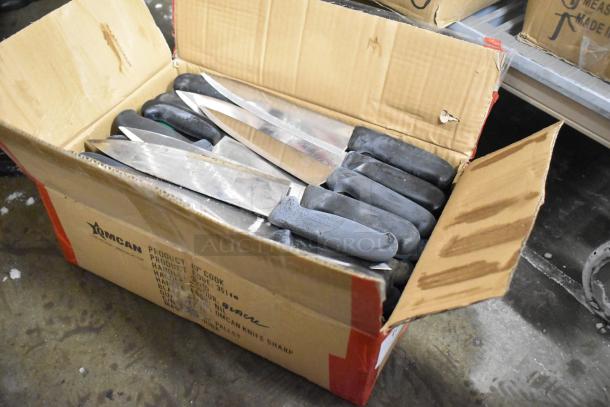 Box of 120 sharpened stainless steel knives with black handles, including chef knives. Labeled "Omcan Product."