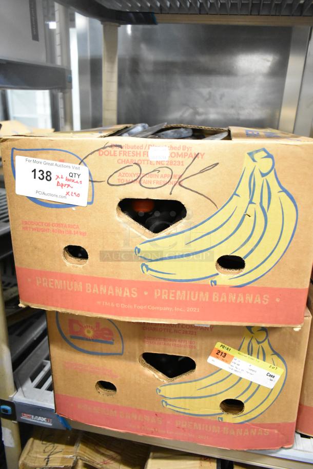 Cardboard boxes of Dole premium bananas, each labeled with auction details. Contains 220 sharpened stainless steel knives.