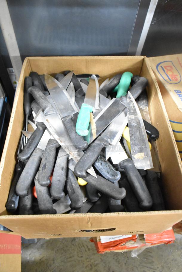 Box of 150 sharpened stainless steel knives, including chef knives, various handle colors, good condition.