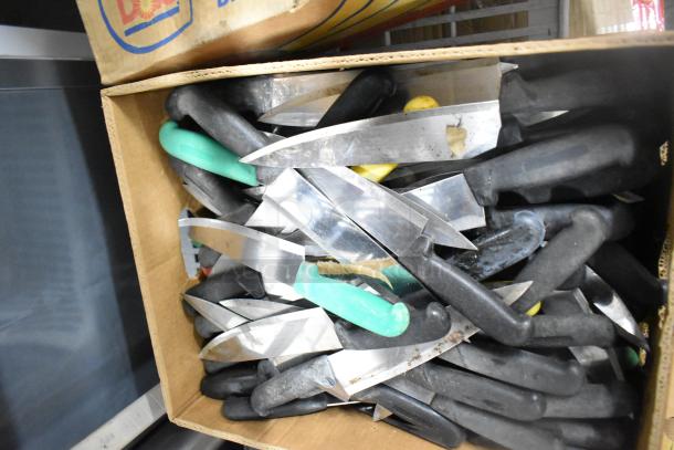 Box of 150 sharpened stainless steel knives with black and colored handles, including chef knives, in good condition.