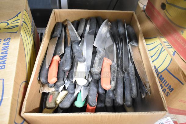 Box of 150 sharpened stainless steel knives, including chef knives, mixed handle colors, shown in used condition.