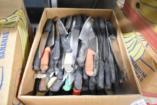 Box of 150 sharpened stainless steel knives, including chef knives, mixed handle colors, shown in used condition.