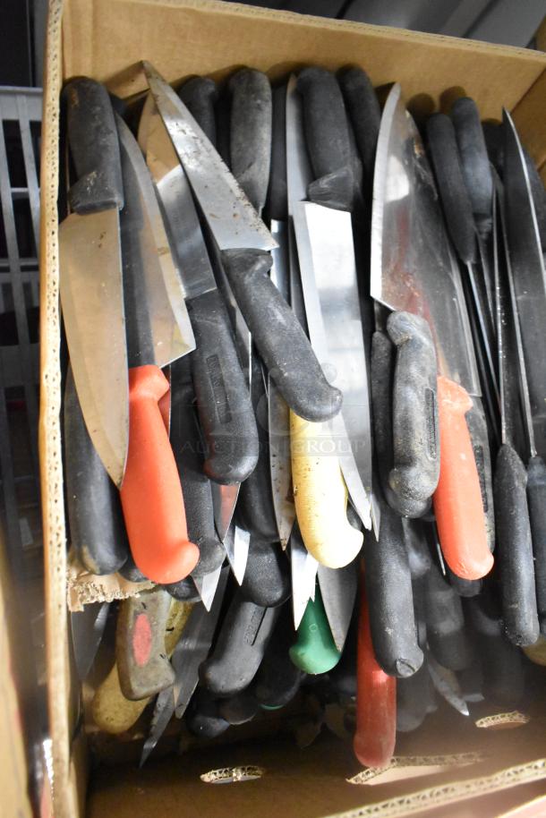 Box of 150 stainless steel knives, including chef knives, with various colored handles. Good condition.
