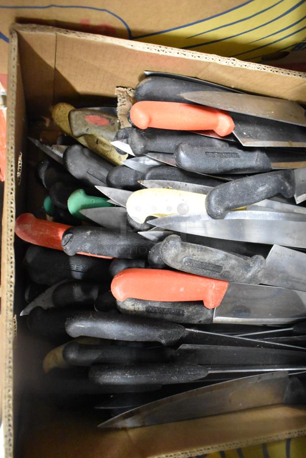 Box of 150 sharpened stainless steel knives with multicolored handles, including a chef knife. Durable, mixed condition.
