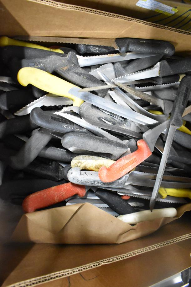 Box of 200 sharpened stainless steel knives, including chef and serrated types, with various colored handles.