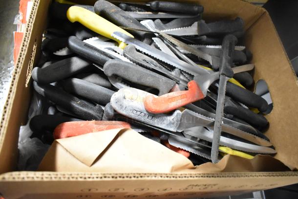 Box of 200 sharpened stainless steel knives, including chef and serrated knives. Various colored handles, ready for bidding.