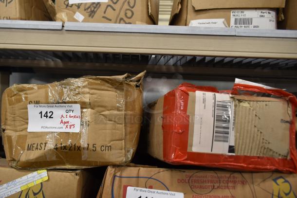 Two boxes labeled "142" containing approximately 85 sharpened stainless steel knives, including a chef knife.