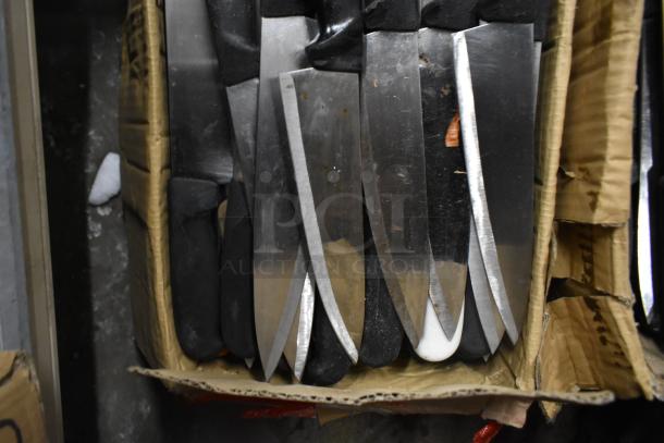 A collection of 85 sharpened stainless steel knives, including chef knives, displayed in a cardboard box with black handles.