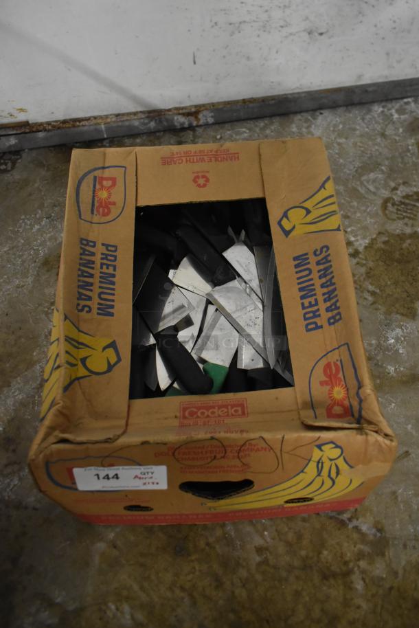 Box of 150 sharpened stainless steel knives, includes chef knife, assorted handles, packed in a used cardboard box.