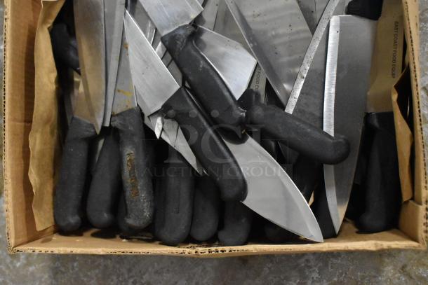 Box of 150 sharpened stainless steel knives, including chef knives, with black handles, showing some wear.