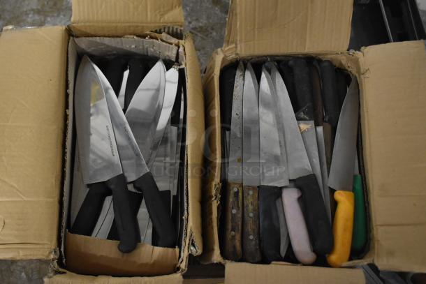 Two boxes containing 150 sharpened stainless steel knives, including chef knives. Handles are varied in color and style.