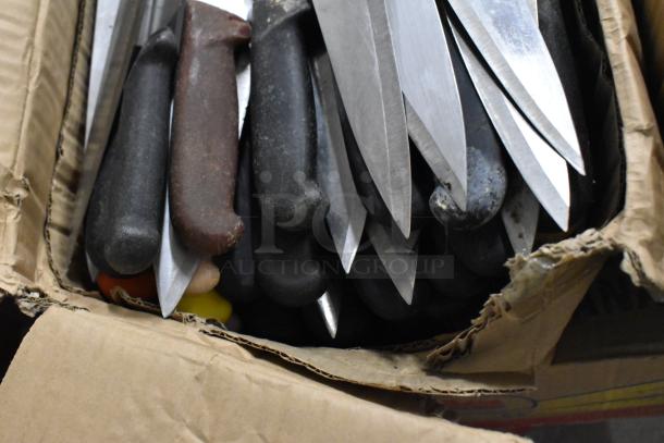 Box of 150 sharpened stainless steel knives with assorted handles, including a chef knife. Appears used, assorted conditions.