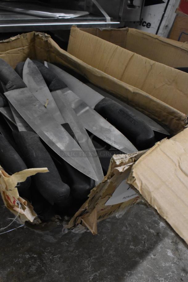 Box of 150 sharpened stainless steel knives, including chef knives, with black handles in fair condition.