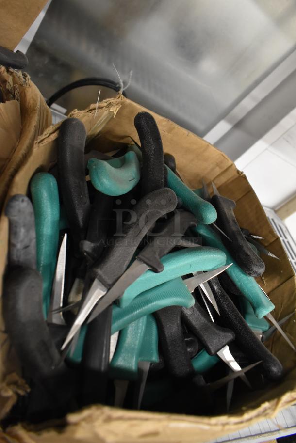 Box of 200 sharpened stainless steel knives, including poultry and paring knives, assorted styles and handles.