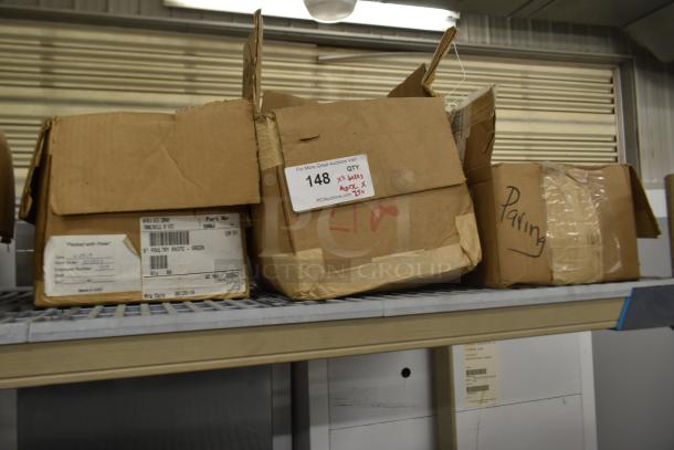 Cardboard boxes containing 250 sharpened stainless steel knives, including a poultry knife, labeled on shelf.