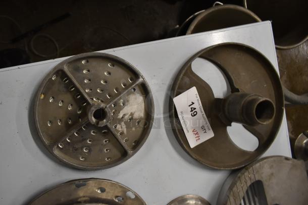 12 blades for Pelican Head Slicer, including grating and slicing types. Metal construction, used condition. Auction tag "149."