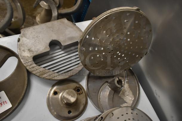 12 metal blades for Pelican Head Slicer including grating and slicing types. Used condition, various shapes and functions.