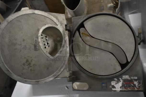 Three Pelican Head Slicers; one missing front, one missing blade. Visible wear and NSF label on metal exterior.