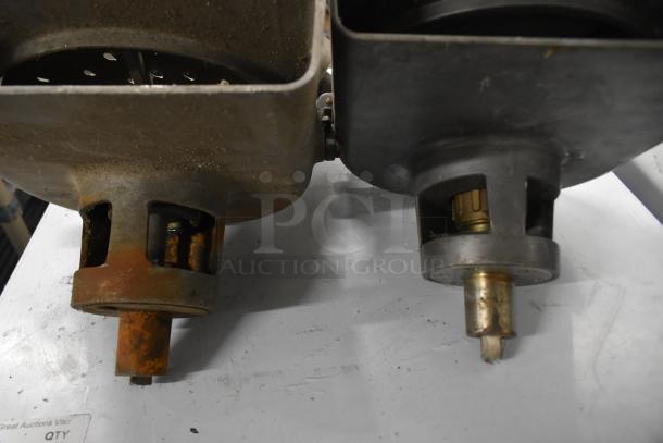 Three Pelican Head Slicers, one missing front, one missing blade, showing visible wear and rust.