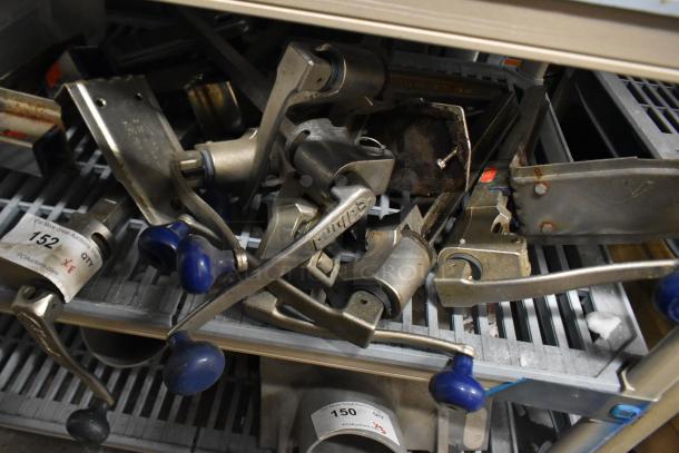 Seven commercial can openers with mounts, blue handles, metal construction, one marked "Dixie," mixed condition, visible auction tags.