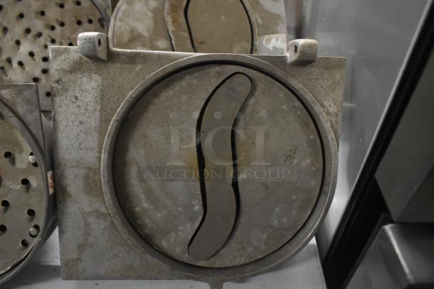 4 Pelican heads with blades; 2 grating, 2 slicing. Missing front pieces. Well-used condition, metal construction.